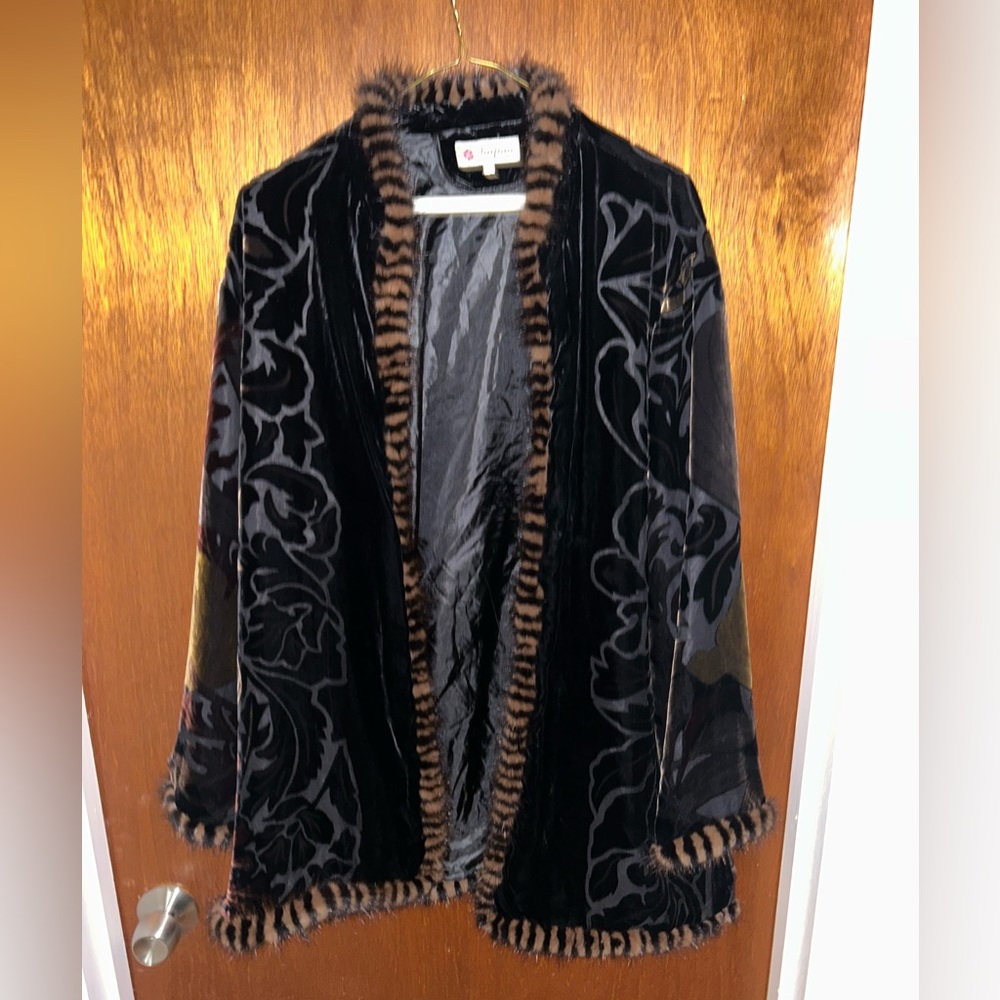 Excellent condition trimmed in fur